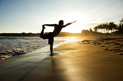 Man Stretching on Beach
