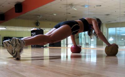 Push ups with two medicine balls